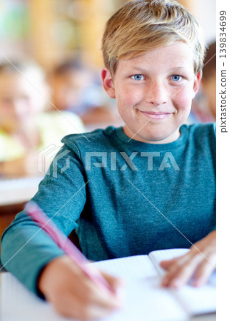 Student, portrait and writing notes for learning in classroom, boy and problem solving at school. Male person, child and study information for exam prep in notebook, solution and journal for test Student, portrait and writing notes for learning in classroom, boy and problem solving at school. Male person, child and study information for exam prep in notebook, solution and journal for test 139834699
