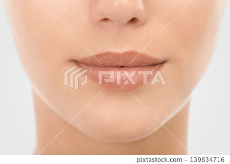 Beauty, face and lips for skincare with makeup for natural look, closeup and wellness for self care. Woman, dermatology and cosmetics in studio with mockup space, facial and routine for healthy skin 139834716
