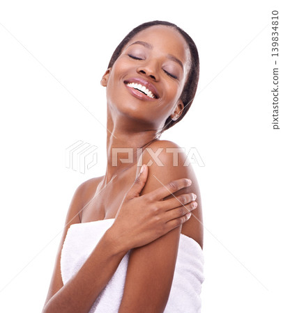 Black woman, smile and skincare in studio for wellness, glow or feminine grooming in towel. Face, happy and cosmetics with hand on arm pose for beauty, makeup or facial treatment on white background Black woman, smile and skincare in studio for wellness, glow or feminine grooming in towel. Face, happy and cosmetics with hand on arm pose for beauty, makeup or facial treatment on white background 139834810