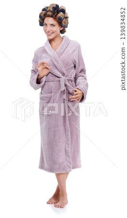 Portrait, hair and bathrobe with woman curling in studio isolated on white background for pampering. Smile, beauty and wellness with happy young person in bathroom to relax for haircare treatment Portrait, hair and bathrobe with woman curling in studio isolated on white background for pampering. Smile, beauty and wellness with happy young person in bathroom to relax for haircare treatment 139834852