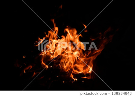 Fire flame isolated on black isolated background - Beautiful yellow, orange and red and red blaze fire flame texture Fire flame isolated on black isolated background - Beautiful yellow, orange and red and red blaze fire flame texture 139834943