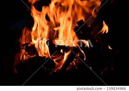 Fire flame isolated on black isolated background - Beautiful yellow, orange and red and red blaze fire flame Fire flame isolated on black isolated background - Beautiful yellow, orange and red and red blaze fire flame 139834966