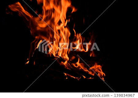 Fire flame isolated on black isolated background - Beautiful yellow, orange and red and red blaze fire flame Fire flame isolated on black isolated background - Beautiful yellow, orange and red and red blaze fire flame 139834967