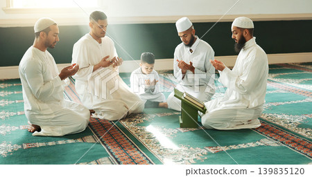 Muslim, praying and men with child in Mosque for spiritual religion together as family to worship Allah in Ramadan. Islamic, Arabic and holy people with peace or respect for gratitude, trust and hope Muslim, praying and men with child in Mosque for spiritual religion together as family to worship Allah in Ramadan. Islamic, Arabic and holy people with peace or respect for gratitude, trust and hope 139835120