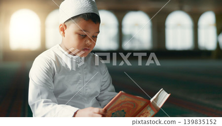 Islam, child in mosque reading Quran for learning, mindfulness and gratitude in faith with prayer. Worship, religion and Muslim student in holy temple praise with book, spiritual teaching and study. Islam, child in mosque reading Quran for learning, mindfulness and gratitude in faith with prayer. Worship, religion and Muslim student in holy temple praise with book, spiritual teaching and study. 139835152