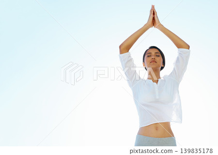 Woman, meditation and zen for spiritual wellness, awareness or outdoor yoga with blue sky background. Calm female person or yogi meditating for inner peace, breathing or health on mockup space Woman, meditation and zen for spiritual wellness, awareness or outdoor yoga with blue sky background. Calm female person or yogi meditating for inner peace, breathing or health on mockup space 139835178