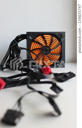 Blurred Power Cables And Connectors In Front Of Power Supply For Computer Blurred Power Cables And Connectors In Front Of Power Supply For Computer 139835747