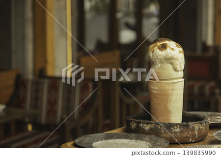 Famous Turkish dish testi kebab or kebab in pot, stew of meat and vegetables in clay pot with bread lid Famous Turkish dish testi kebab or kebab in pot, stew of meat and vegetables in clay pot with bread lid 139835990