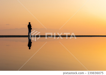 Winter in the Seto Inland Sea: Chichibugahama Beach at sunset in Mitoyo City, Kagawa Prefecture. Winter in the Seto Inland Sea: Chichibugahama Beach at sunset in Mitoyo City, Kagawa Prefecture. 139836075