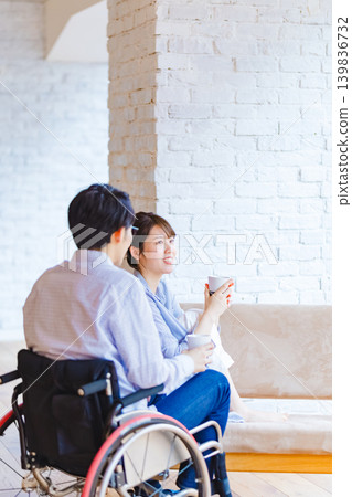 Wheelchair man and woman young couple Wheelchair man and woman young couple 139836732