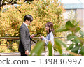 A young man and woman exchanging greetings on their first meeting and first date. 139836997
