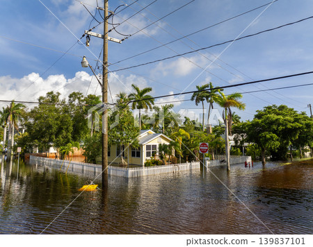 Flooded residential area with underwater houses from hurricane rainfall water in Florida. Aftermath of natural disaster in southern USA Flooded residential area with underwater houses from hurricane rainfall water in Florida. Aftermath of natural disaster in southern USA 139837101