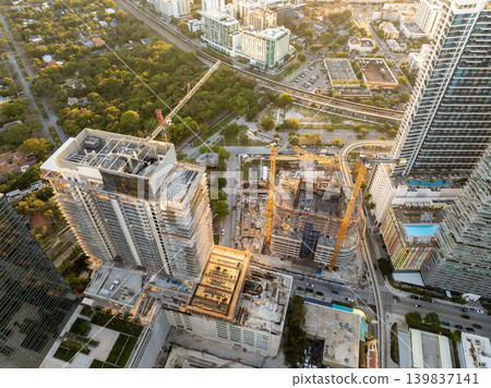 Miami, Florida. New construction site of developing residence in American urban area at sunset. Concept of housing growth in the USA 139837141