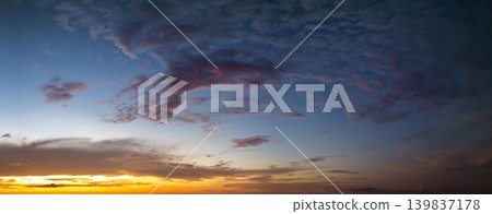 Dramatic sunset sky covered with colorful yellow clouds. Panoramic skyscape Dramatic sunset sky covered with colorful yellow clouds. Panoramic skyscape 139837178