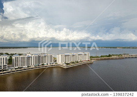 Strong winds and heavy rain about to strike bay shore tourist resort in Florida. Guests experiencing sudden interruption to vacations. Strong winds and heavy rain about to strike bay shore tourist resort in Florida. Guests experiencing sudden interruption to vacations. 139837242