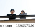 A couple talking on the rooftop 139837380