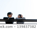 A couple talking on the rooftop 139837382