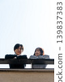A couple talking on the rooftop 139837383