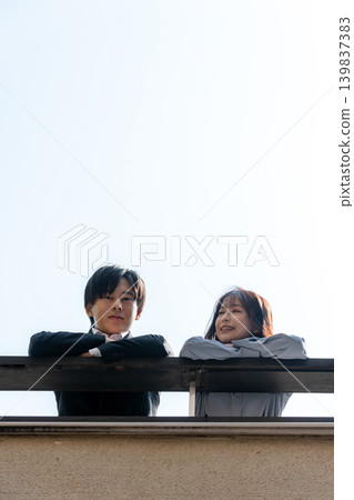 A couple talking on the rooftop A couple talking on the rooftop 139837383