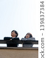 A couple talking on the rooftop 139837384