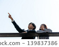 A couple talking on the rooftop 139837386