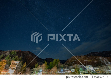 A winter starscape photograph of Okutadami with thin clouds drifting by (mountain village, Niigata Prefecture) A winter starscape photograph of Okutadami with thin clouds drifting by (mountain village, Niigata Prefecture) 139837395