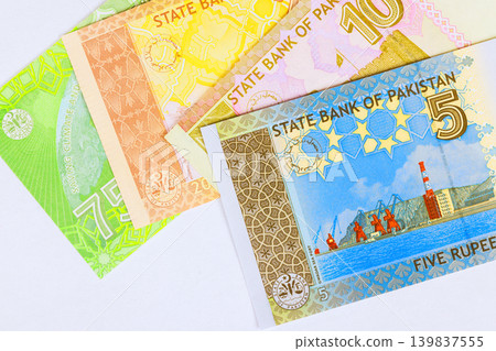 Pakistani rupee paper currency banknotes in various denominations issued by State Bank of Pakistan as financial cash Pakistani rupee paper currency banknotes in various denominations issued by State Bank of Pakistan as financial cash 139837555