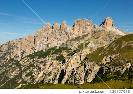 Rocky peaks and verdant slopes of Torre dei Scarperi in Dolomite Alps Rocky peaks and verdant slopes of Torre dei Scarperi in Dolomite Alps 139837986