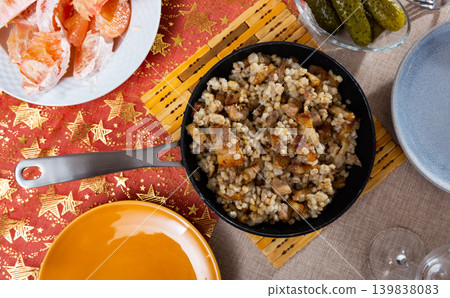 restaurant serves steamed pearl barley porridge with pork fried bacon and pickles, olives in pan restaurant serves steamed pearl barley porridge with pork fried bacon and pickles, olives in pan 139838083