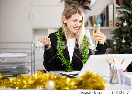 Woman having video call in office during Christmas Woman having video call in office during Christmas 139838197