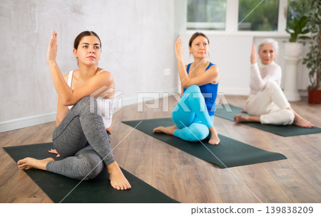 Young woman doing yoga in fitness studio Young woman doing yoga in fitness studio 139838209