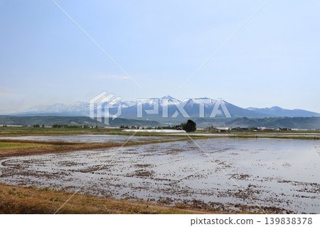 Springtime rural landscapes and snow-capped mountains of Hokkaido Springtime rural landscapes and snow-capped mountains of Hokkaido 139838378