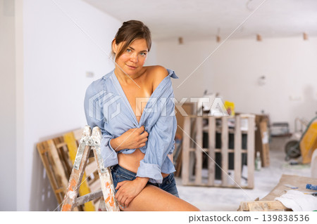 Portrait of a tempting poses woman in a revealing outfit Portrait of a tempting poses woman in a revealing outfit 139838536