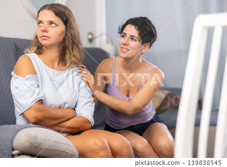 Woman comforting her friend after domestic quarrel Woman comforting her friend after domestic quarrel 139838545