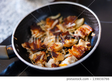 Roast pork with onion in pan 139838766