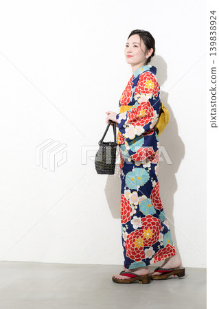 An image of a cute Japanese woman in a yukata walking against a white background, suggesting Japanese sightseeing, outings, and leisure activities. An image of a cute Japanese woman in a yukata walking against a white background, suggesting Japanese sightseeing, outings, and leisure activities. 139838924