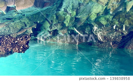 The Blue Grotto (Hachinohe Cave) in Jodogahama, Miyako City, Iwate Prefecture, where the water surface and rock face shimmer emerald green in the morning sunlight. The Blue Grotto (Hachinohe Cave) in Jodogahama, Miyako City, Iwate Prefecture, where the water surface and rock face shimmer emerald green in the morning sunlight. 139838958