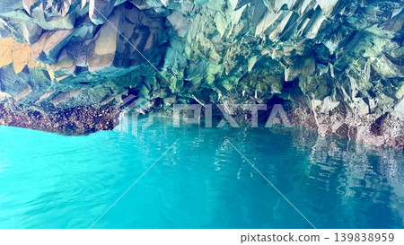 The Blue Grotto (Hachinohe Cave) in Jodogahama, Miyako City, Iwate Prefecture, where the water surface and rock face shimmer emerald green in the morning sunlight. The Blue Grotto (Hachinohe Cave) in Jodogahama, Miyako City, Iwate Prefecture, where the water surface and rock face shimmer emerald green in the morning sunlight. 139838959