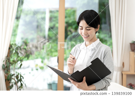 Young female caregivers with bright smiles working in nursing homes and home care services. Young female caregivers with bright smiles working in nursing homes and home care services. 139839100