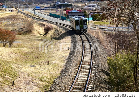 Kiha 100 series diesel railcar running on the JR Kamaishi Line Kiha 100 series diesel railcar running on the JR Kamaishi Line 139839135