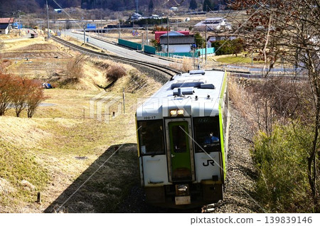 Kiha 100 series diesel railcar running on the JR Kamaishi Line Kiha 100 series diesel railcar running on the JR Kamaishi Line 139839146