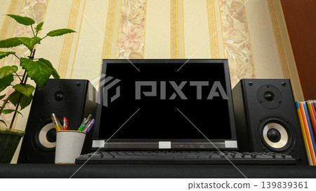 computer screen between two large black speakers on a desk computer screen between two large black speakers on a desk 139839361