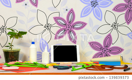 front view of a creative table with a tablet 139839373