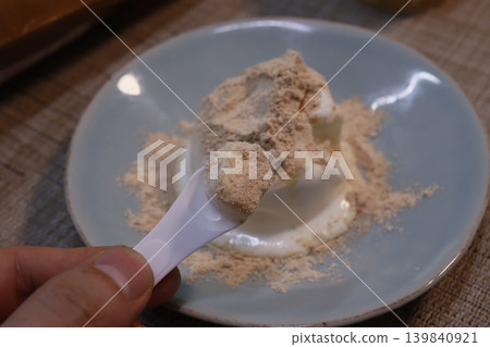 Spoon with Cream and Powder on Plate 139840921