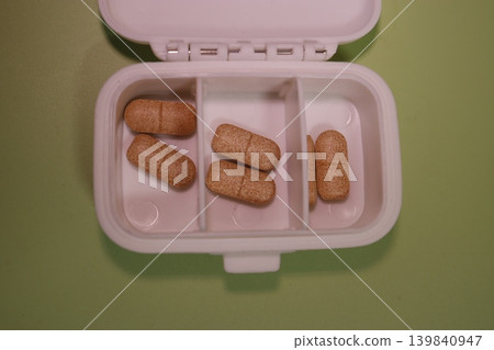 Pill Organizer with Brown Pills Pill Organizer with Brown Pills 139840947