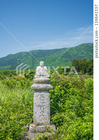 A roadside Buddha statue nestled in the rural area of Oku-Biwako, Makino-cho, Takashima City, Shiga Prefecture A roadside Buddha statue nestled in the rural area of Oku-Biwako, Makino-cho, Takashima City, Shiga Prefecture 139841337