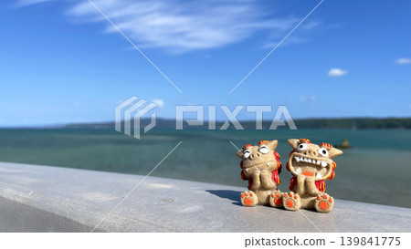 Shisa statues and the sea: Okinawan scenery, Yagaji Island, Nago City, Okinawa Prefecture 139841775