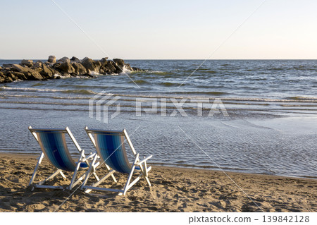 Two beach chairs on the beach on the Tyrrhenian Sea Two beach chairs on the beach on the Tyrrhenian Sea 139842128