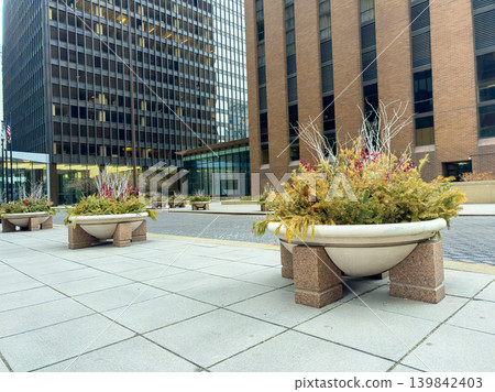 City street with planters and buildings during a cloudy day in the downtown area City street with planters and buildings during a cloudy day in the downtown area 139842403