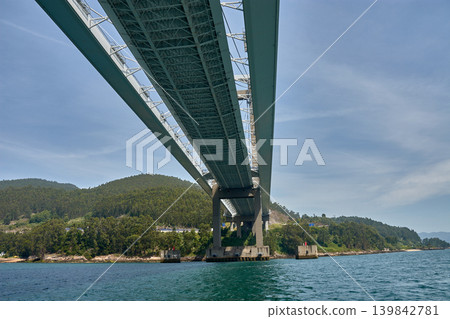 Low-angle perspective of the concrete columns and beams of the Rande Bridge in the province of Vigo Low-angle perspective of the concrete columns and beams of the Rande Bridge in the province of Vigo 139842781